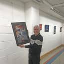 Jim Duffy with one of his pieces in the exhibition.