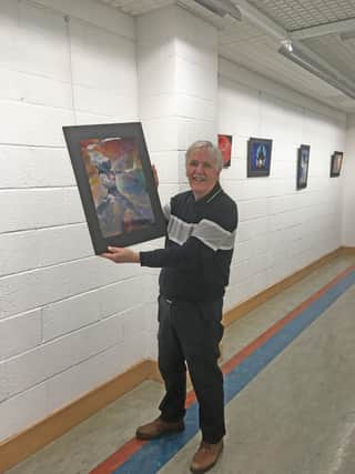 Jim Duffy with one of his pieces in the exhibition.