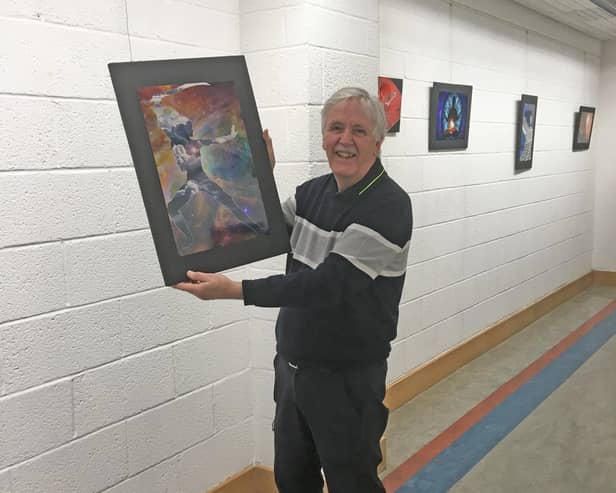 Jim Duffy with one of his pieces in the exhibition.