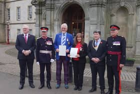Harry Brodie and Christine Bell (centre) were presented with British Empire Medals at a ceremony at Callendar House last week after being named in the King's Birthday Honours.  (Pic: submitted)