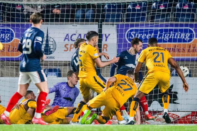 FALKIRK, SCOTLAND - JANUARY 31: Livingston's Reece McAlear (centre) bundles the ball into the net to make it 2-0 during a William Hill Championship match between Falkirk and Livingston at The Falkirk Stadium, on January 31, 2025, in Falkirk, Scotland, (Photo by Sammy Turner / SNS Group)