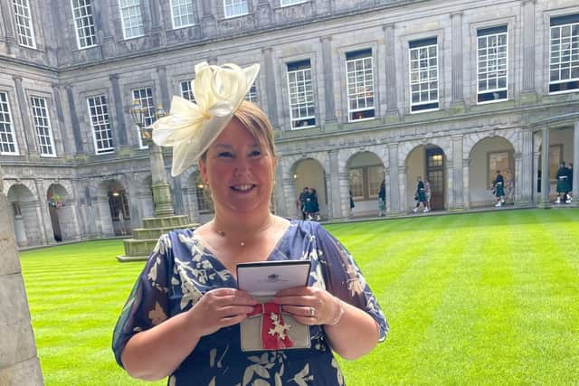 Margaret Wilson receiving her MBE at the Palace of Holyrood. Pic: Contributed