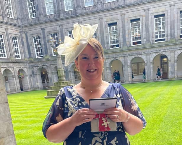 Margaret Wilson receiving her MBE at the Palace of Holyrood. Pic: Contributed