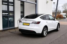 The Tesla was photographed parked next to the school with a charging cable running through a window into the school building - despite the fact there were charging points just yards away in the car park (Picture: Michael Gillen, National Word)