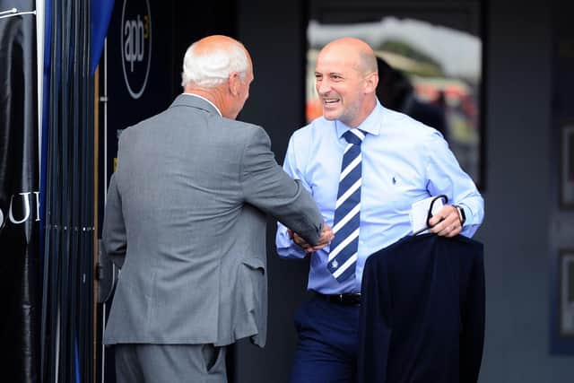 A handshake with current Falkirk boss Paul Sheerin
