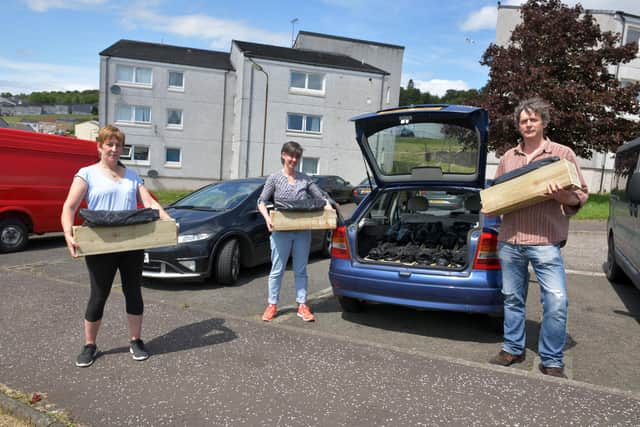 From left: Sylvia Kay, chairwoman of Ettrick Dochart Community Hall and Foodbank, which is benefitting from the Veg Your Ledge kits; Claire Aitken, committee member of Ettrick Dochart Community Hall and Foodbank; and Richard Chatfield, Forth Environment Link wood reuse officer. Picture: Michael Gillen.