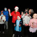 Lauren Sinclair (red T-shirt), founder of the Worldwide Santa's Christmas Eve Jingle Facebook page, took part in the event with family, friends and neighbours. Picture: Michael Gillen.