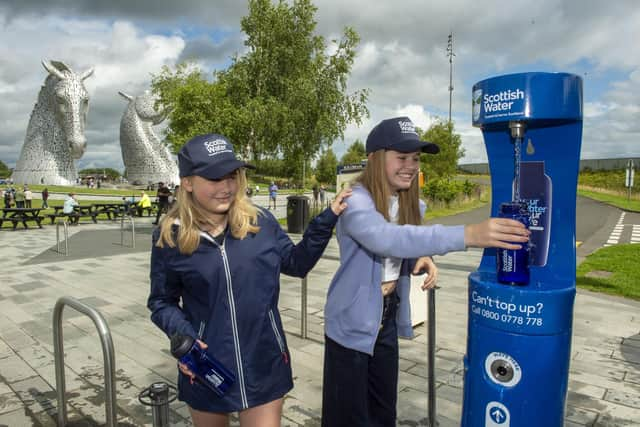 Lucy and Hannah Lironi help launch Scottish Water’s latest tap at the Helix Park in the shadow of The Kelpies. Pic: Ian Rutherford