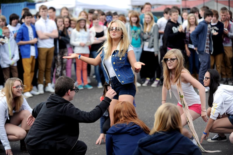 This dance act has a crowd gathering.