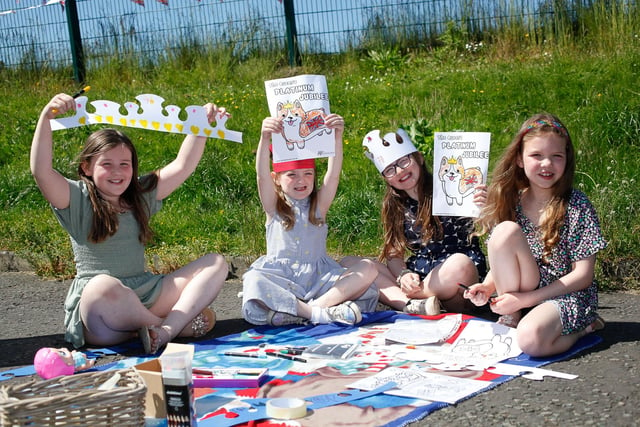 Molly, 7, Rhianne, 6, Elise, 9, and Freya, 8, making crowns and colouring in corgis