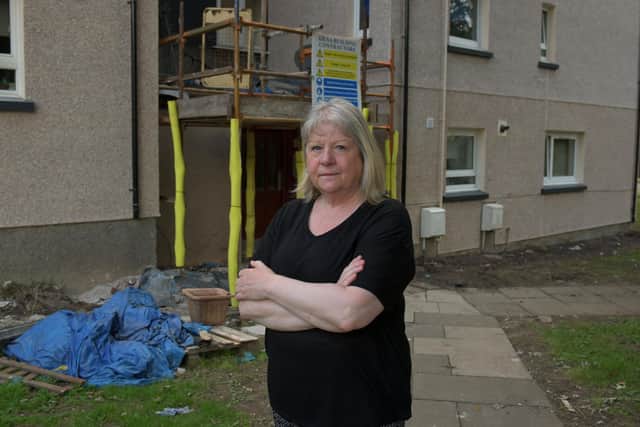 Margaret Scott outside her home in Derwent Avenue, Falkirk which has been left in a terrible state due to work carried out by council contractors