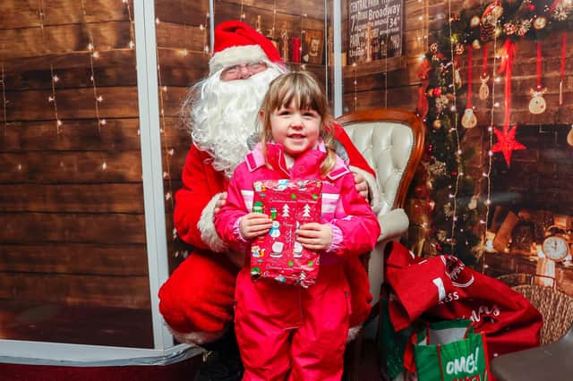 Santa will be back in the Roots mobile grotto this year.  Here's one of his young visitors from last year - Ella Denholm.