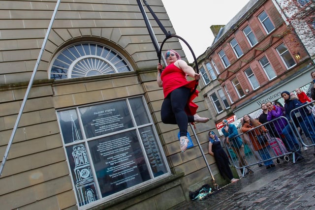 The acrobats entertained crowds below the Steeple on the High Street.