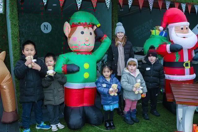 Lots of happy faces with their teddies after meeting Santa