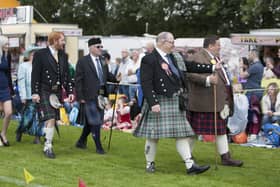 Chieftain Harry Fairley walks round the park with President Hugh Craig at the 144th Airth Highland Games