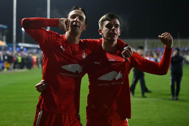Liam Henderson and Matthew Wright celebrate at full-time