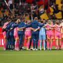 Michael McArdle, interim head coach of Scotland, speaks to the team in a post match huddle after the 6-1 Germany loss (Photo by Maja Hitij/Getty Images)