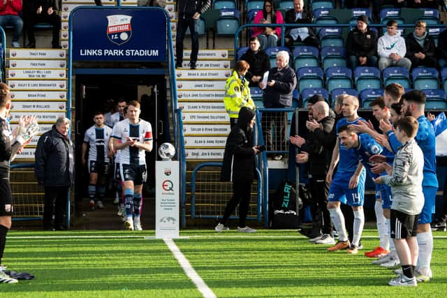 MONTROSE, SCOTLAND - MARCH 30: Falkirk receive a guard of honour during a cinch League One match between Montrose and Falkirk at Links Park Stadium, on March 30, 2024, in Montrose, Scotland.  (Photo by Sammy Turner / SNS Group)