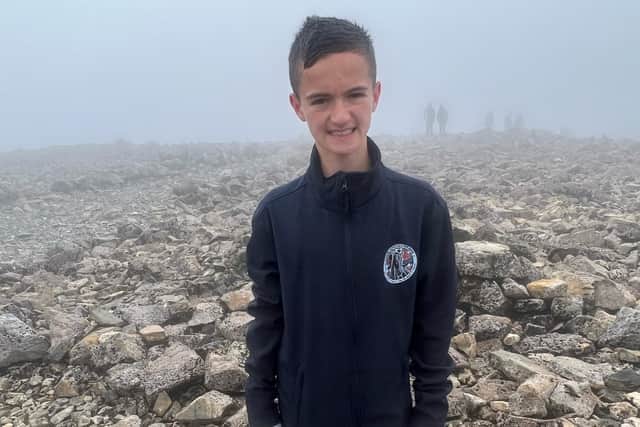Luke Baillie, 12, at the peak of Ben Nevis on his fund raising challenge for Falkirk Schools Pipe Band
(Picture: Submitted)