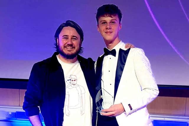 Jasiu Janowiec won the AMES Award for Best Higher Media Award at the Scottish Youth Film Festival at the weekend.  He's pictured here with his award and teacher Fraser Johnston.  (Pic: submitted)