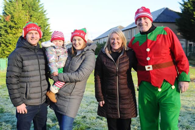 Stenhousemuir man Cameron Shanks (right) and family, including granddaughter Emily, helped to raise funds for Maggie's Forth Valley via its Elf Family Fun Run. Picture: Michael Gillen.