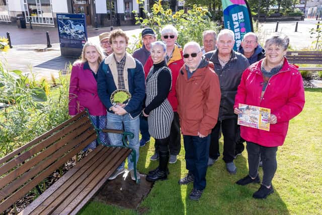 Members of Denny and Bonnybridge Community Shed worked with pupils from St Mungo's RC High School to make benches for the garden.  (Pic: Michael Gillen)