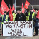 Workers made their feelings clear as they formed a picket line outside council headquarters. (Pic: Stuart Vance)