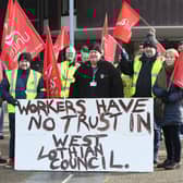 Workers made their feelings clear as they formed a picket line outside council headquarters. (Pic: Stuart Vance)