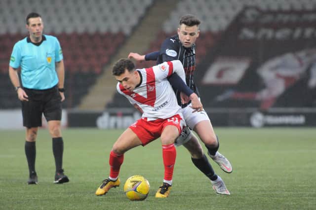 Anton Dowds battles for the ball in midfield (Pictures by Alan Murray)