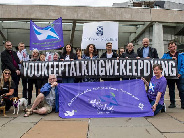 The group Faces And Voices of Recovery hold a protest outside the Scottish Parliament as Scotland's drugs death figures were published on July 28, 2022 in Edinburgh. Photo by Lisa Ferguson.