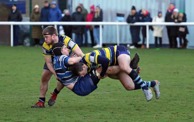 Graham Gilliland goes in for a crunching tackle (Pictures by Gordon Honeyman)
