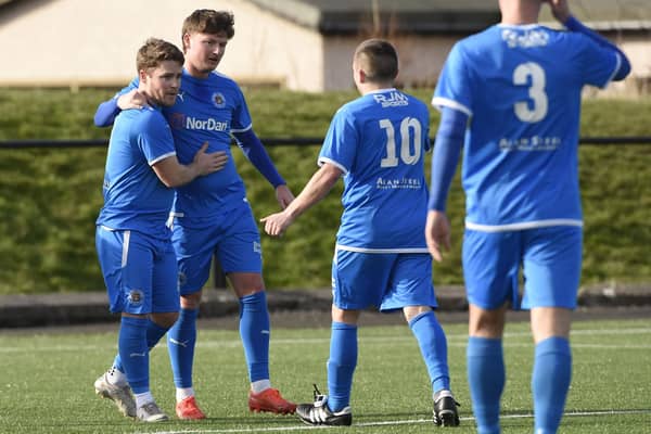 Sandy Cunningham (left) celebrates opening the scoring for Bo’ness Athletic against Oakley United last Saturday (Photo: Alan Murray)
