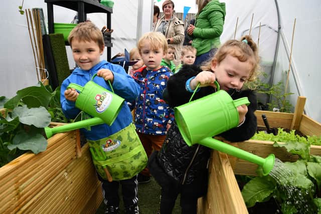 Oscar Brogan, 4, from Falkirk, and Emily Smith, 3, from Falkirk are busy watering plants in the allotment