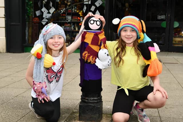 Lottie and Ivy-Rose helped the Bairns Bombers brighten up the High Street.  Pic: Michael Gillen.