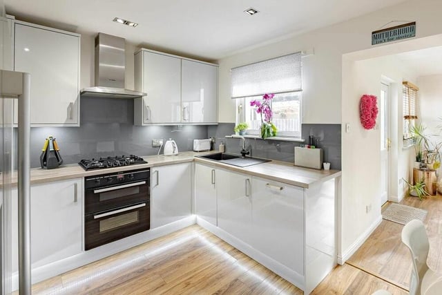 The bright and light kitchen offers an incredible spec with the convenience of a built-in breakfast bar too.