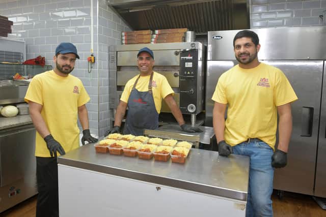 Indian Cottage staff Adil Amir, kebab chef; Haseev Ahmed, curry chef; and Ammar Ali, owner. Picture: Michael Gillen.