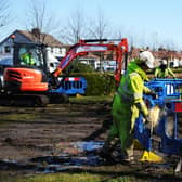 The Scottish Water team work to repair the burst water main in Dalgrain, Grangemouth