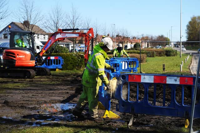 The Scottish Water team work to repair the burst water main in Dalgrain, Grangemouth