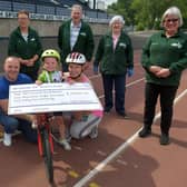 Dad Liam, Ché and mum Laura handed over the cheque to representatives from Falkirk Foodbank.  Pic: Michael Gillen