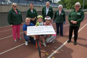 Dad Liam, Ché and mum Laura handed over the cheque to representatives from Falkirk Foodbank.  Pic: Michael Gillen