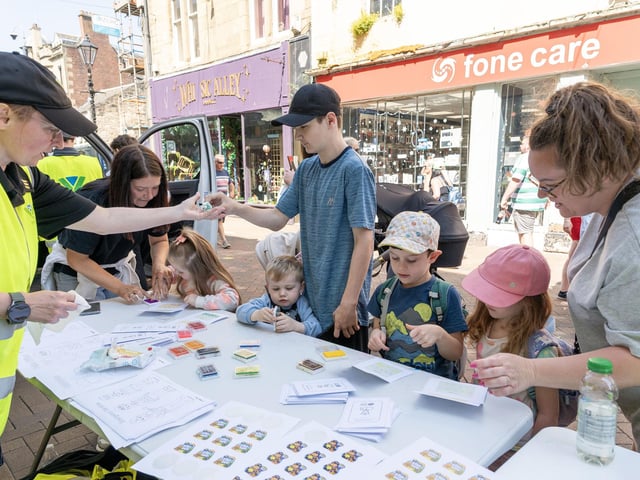 Police Scotland Youth Volunteers hand out goodies.