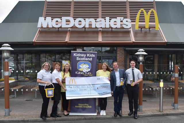 McDonald's cheque for £20,000 thanks to 10p carrier bag charge being presented to Kidney Kids Scotland