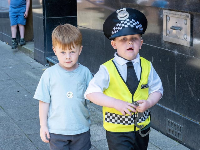 Wearing the uniform.