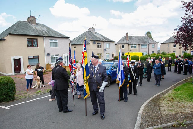 The parade musters in Dundas Crescent, Laurieston, preparing to march to the war memorial