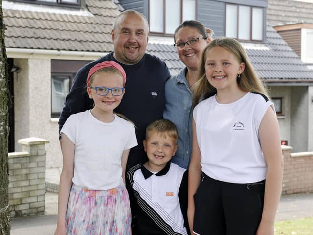 Ellie pictured with sister Kallie (10), who is a bower girl; dad, Thomas; brother Koen (5) and mum, Laura.  Pic: Michael Gillen.