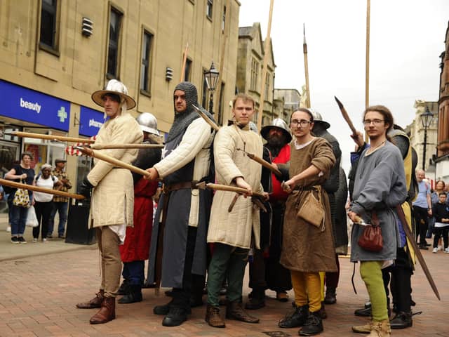In recent years re-enactment groups have brought history to life on Falkirk High Street as part of the Battle of Falkirk 1298 commemoration events. (Pic: Alan Murray)