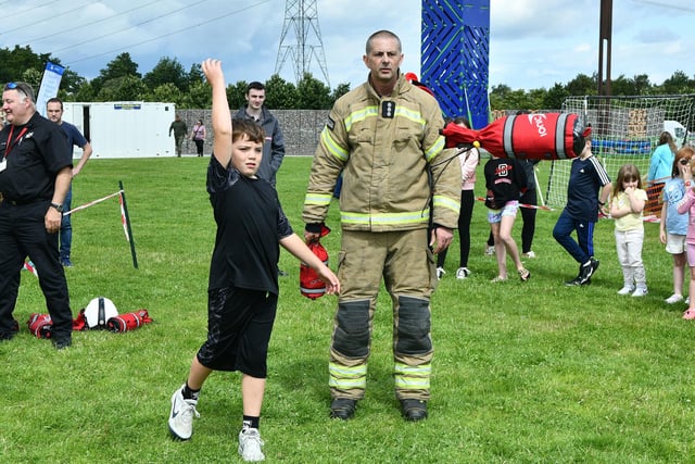 Another youngster accepting the Scottish Fire and Rescue Service throw the line challenge.