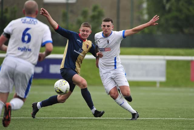 Greg Skinner goes in for a tackle