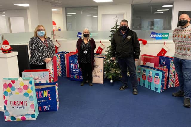 Staff at Grangemouth engineering consultancy firm Doosan Babcock collected Christmas presents for underprivileged schoolchildren. Contributed.