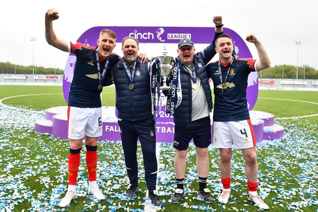 Falkirk management duo Paul Smith and John McGlynn celebrate with the League One title win with Coll Donaldson and Stephen McGinn (Photo: Michael Gillen)